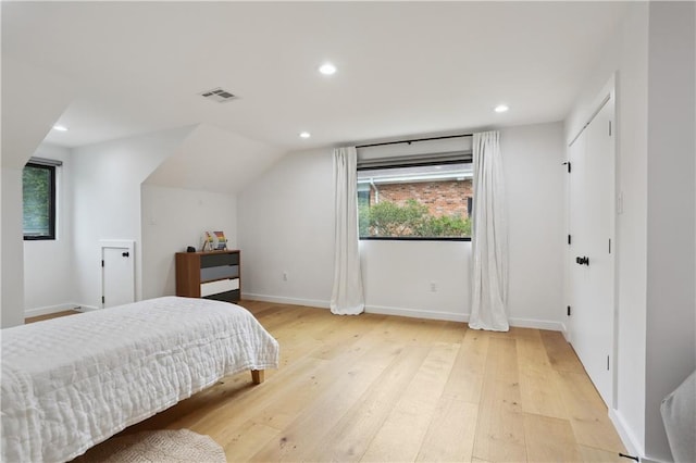 1712 Upperline St, New Orleans, LA 70115 - bedroom with light wood-style flooring, recessed lighting, baseboards, and vaulted ceiling