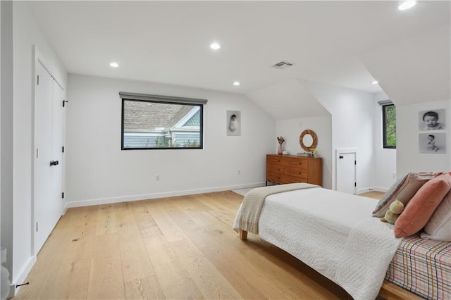 1712 Upperline St, New Orleans, LA 70115 - bedroom with light wood-style floors, recessed lighting, multiple windows, baseboards, and vaulted ceiling