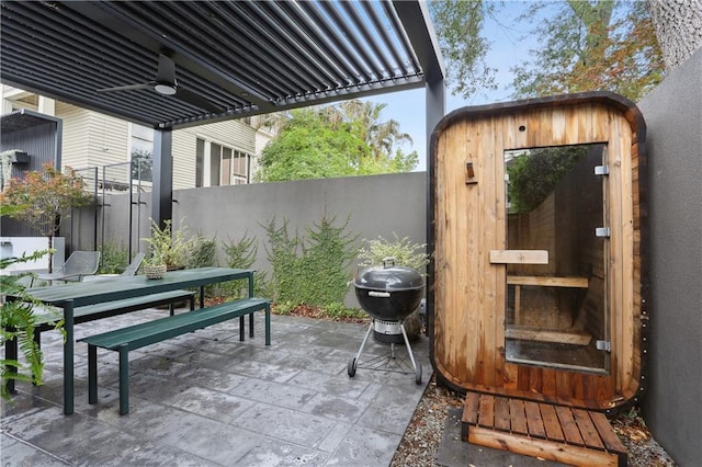 1712 Upperline St, New Orleans, LA 70115 - view of patio / terrace with a storage shed, outdoor dining space, a fenced backyard, an outbuilding, and area for grilling