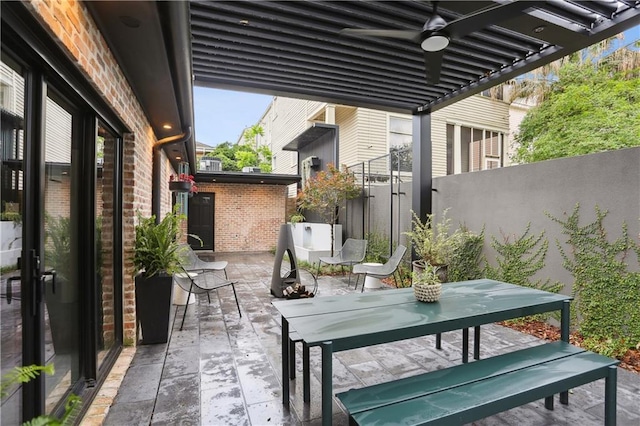 1712 Upperline St, New Orleans, LA 70115 - view of patio featuring fence, outdoor dining area, and a ceiling fan