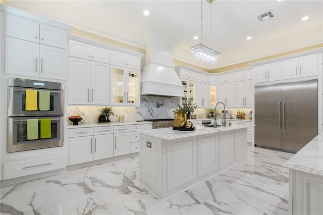 159 Elaine Ave, Harahan, LA 70123 - kitchen featuring stainless steel appliances, a sink, custom exhaust hood, white cabinetry, and backsplash