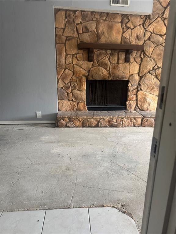 detailed view of a fireplace and baseboards
