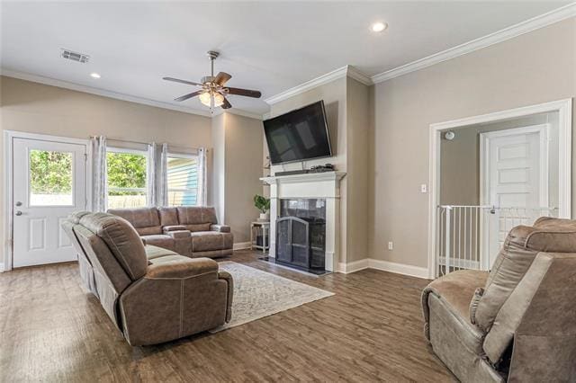 27447 Vela Ln, Lacombe, LA 70445 - living area with ceiling fan, crown molding, baseboards, wood finished floors, and a fireplace with flush hearth