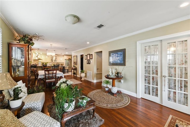 510 Nursery Ave, Metairie, LA 70005 - living room with dark wood-style flooring, baseboards, ornamental molding, and recessed lighting