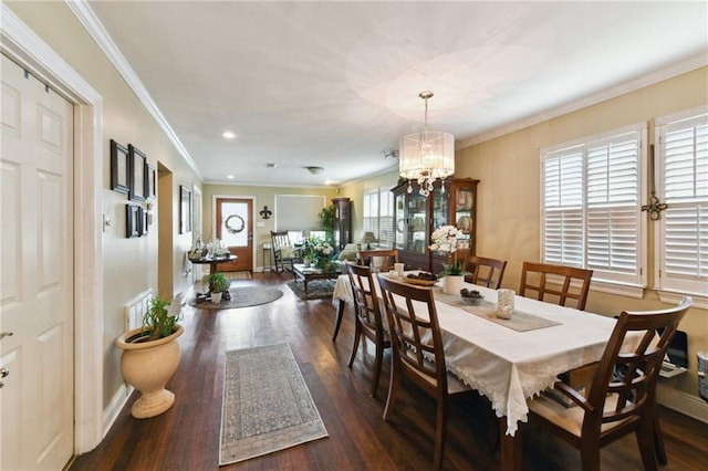 510 Nursery Ave, Metairie, LA 70005 - dining room featuring wood finished floors, a chandelier, crown molding, recessed lighting, and baseboards