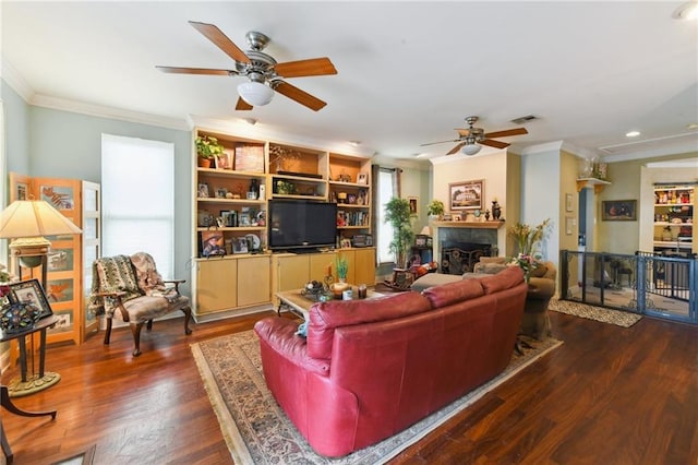 510 Nursery Ave, Metairie, LA 70005 - living room with ceiling fan, crown molding, dark wood finished floors, a fireplace, and recessed lighting
