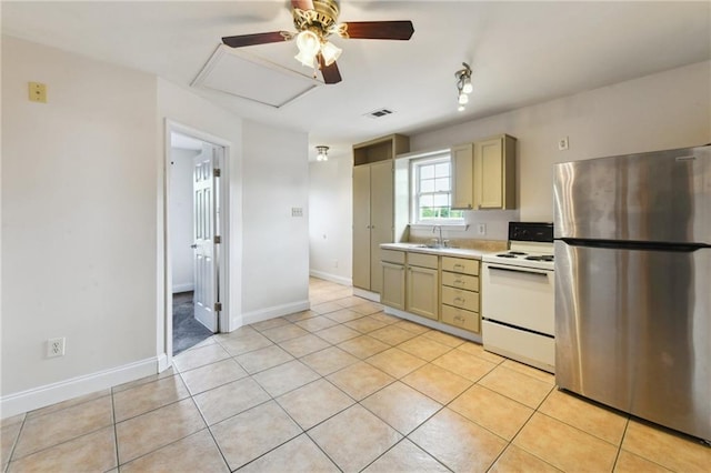 510 Nursery Ave, Metairie, LA 70005 - kitchen featuring freestanding refrigerator, electric stove, a ceiling fan, light countertops, and light tile patterned flooring