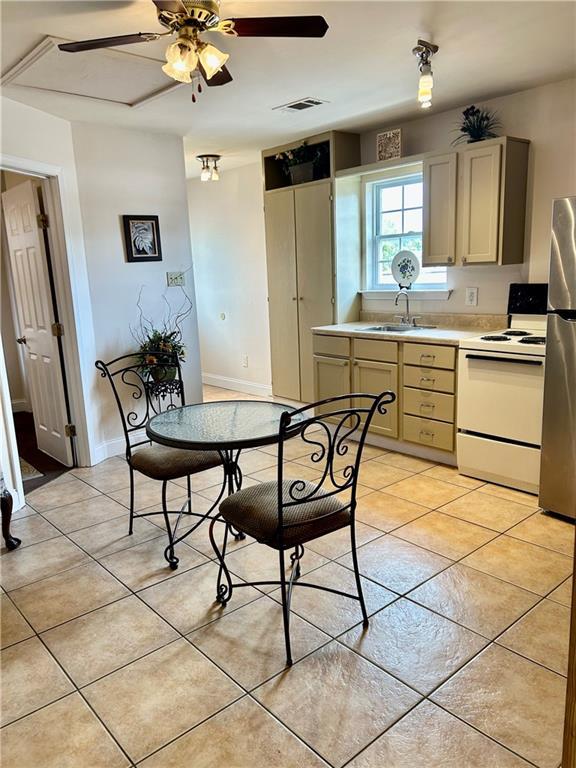 510 Nursery Ave, Metairie, LA 70005 - dining room with light tile patterned floors and ceiling fan