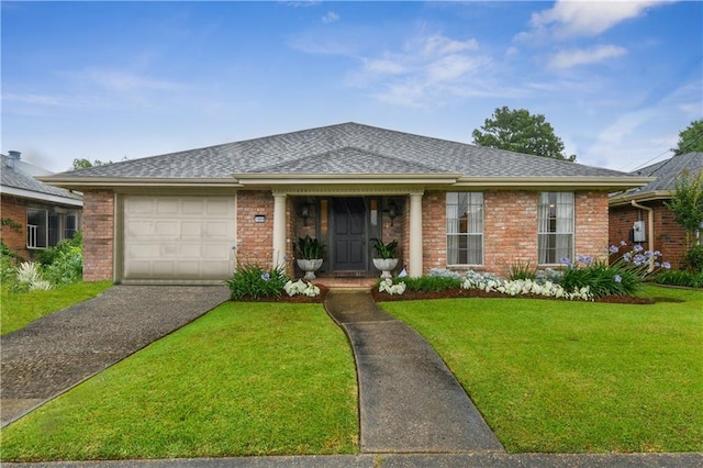 view of front of property featuring a garage, brick siding, a front lawn, asphalt driveway, and a shingled roof