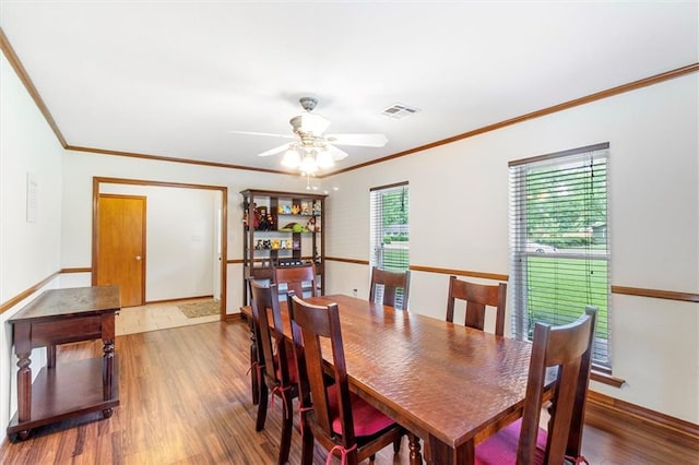 17 S Division Dr, Covington, LA 70433 - dining space featuring ornamental molding, wood finished floors, ceiling fan, and baseboards
