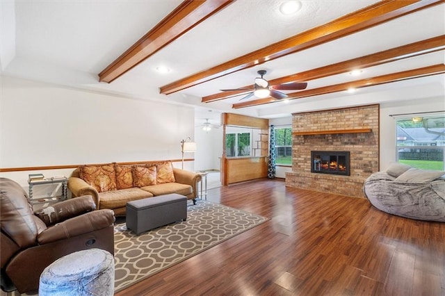 17 S Division Dr, Covington, LA 70433 - living room featuring beamed ceiling, ceiling fan, wood finished floors, a brick fireplace, and recessed lighting