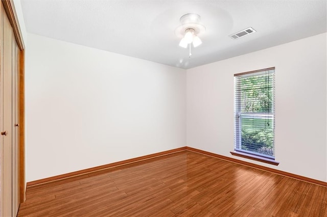 17 S Division Dr, Covington, LA 70433 - empty room with wood finished floors, a ceiling fan, and baseboards