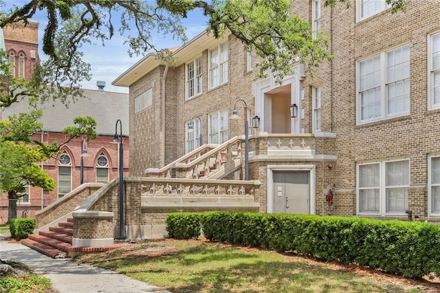 1215 Louisiana Ave Unit 105, New Orleans, LA 70115 - view of building exterior featuring stairs
