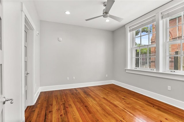 1215 Louisiana Ave Unit 105, New Orleans, LA 70115 - unfurnished room with baseboards, wood finished floors, recessed lighting, and a ceiling fan