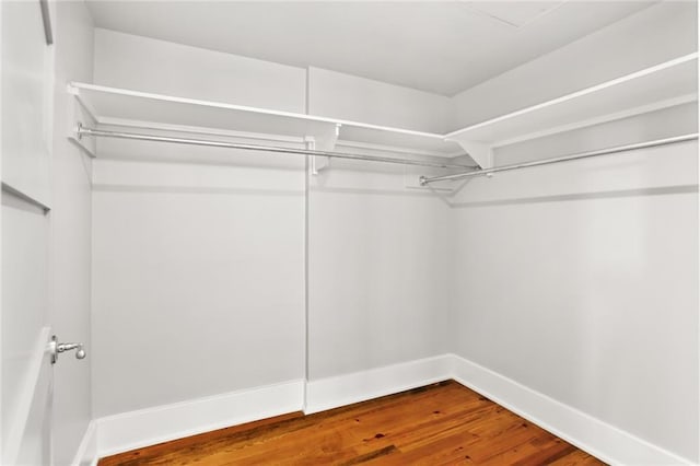 1215 Louisiana Ave Unit 105, New Orleans, LA 70115 - walk in closet with wood finished floors