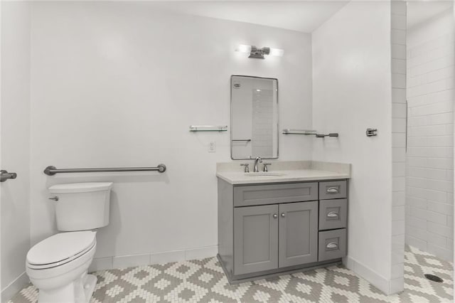 1215 Louisiana Ave Unit 105, New Orleans, LA 70115 - full bathroom with toilet, tiled shower, vanity, tile patterned floors, and baseboards