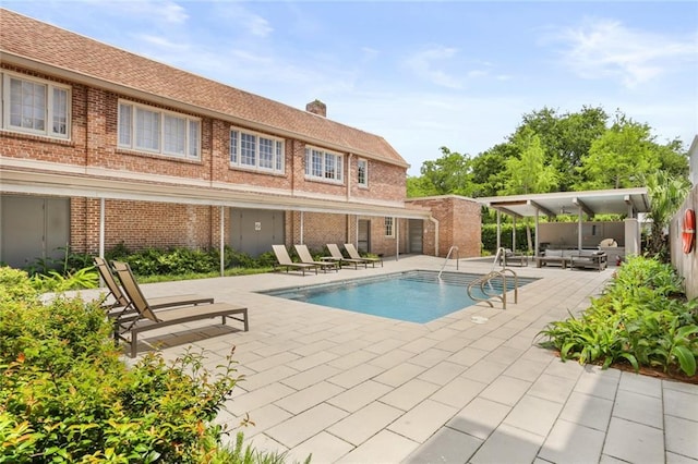 1215 Louisiana Ave Unit 105, New Orleans, LA 70115 - view of pool featuring a patio area and an outdoor hangout area