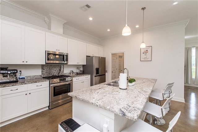 15326 S Tiger Loop, Ponchatoula, LA 70454 - kitchen featuring stainless steel appliances, a sink, a kitchen breakfast bar, a kitchen island with sink, and white cabinets