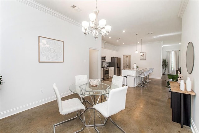 15326 S Tiger Loop, Ponchatoula, LA 70454 - dining area featuring crown molding, finished concrete flooring, a chandelier, and baseboards
