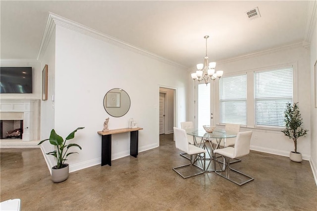 15326 S Tiger Loop, Ponchatoula, LA 70454 - dining space featuring concrete flooring, a chandelier, ornamental molding, baseboards, and a fireplace with raised hearth