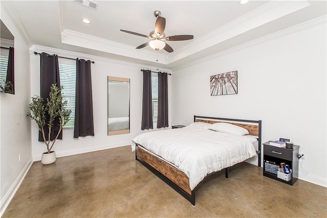 15326 S Tiger Loop, Ponchatoula, LA 70454 - bedroom with a tray ceiling, multiple windows, concrete floors, crown molding, and baseboards