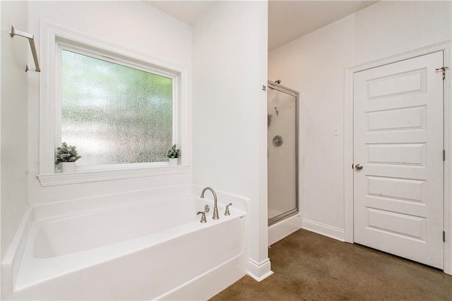 15326 S Tiger Loop, Ponchatoula, LA 70454 - full bathroom with a stall shower, a bath, and baseboards
