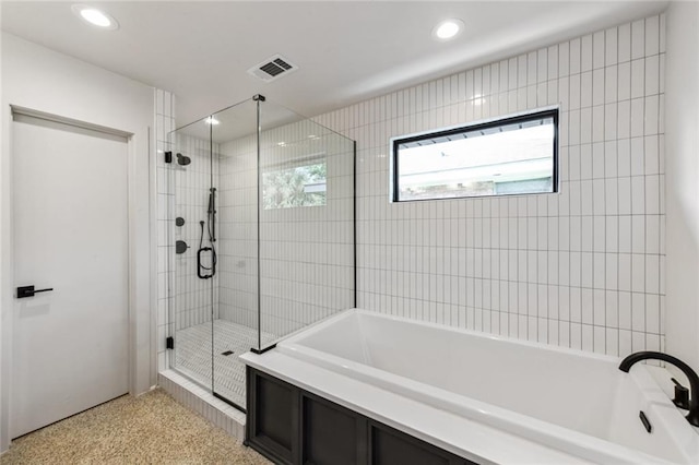 full bath with a shower stall, recessed lighting, a bath, and plenty of natural light
