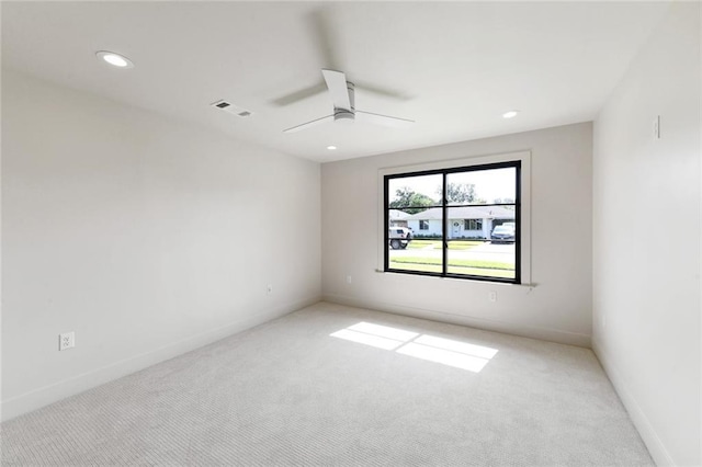 unfurnished room featuring carpet floors, a ceiling fan, recessed lighting, and baseboards