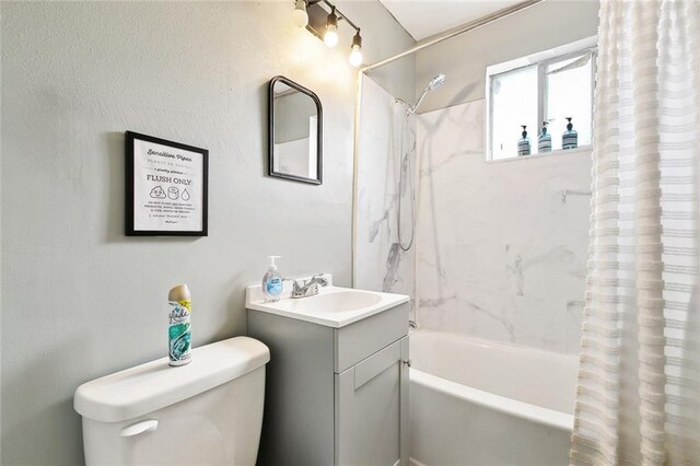 1031 Henriette Delille St Unit 1, New Orleans, LA 70116 - full bathroom featuring toilet, shower / bath combo with shower curtain, and vanity