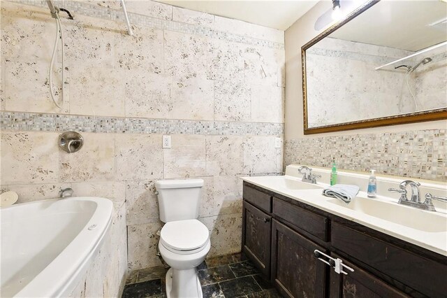 1031 Henriette Delille St Unit 1, New Orleans, LA 70116 - full bathroom with toilet, a tub, double vanity, tile walls, and a shower