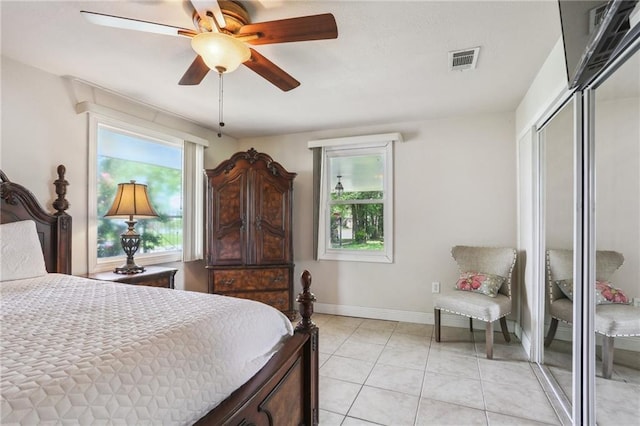 922 Lamanche St, New Orleans, LA 70117 - bedroom with a closet, light tile patterned floors, baseboards, and a ceiling fan