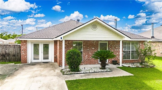 717 Magnolia Ave, La Place, LA 70068 - view of front facade with brick siding and french doors