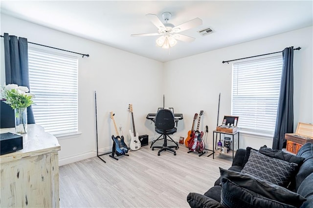 717 Magnolia Ave, La Place, LA 70068 - office space featuring light wood-type flooring, plenty of natural light, and a ceiling fan