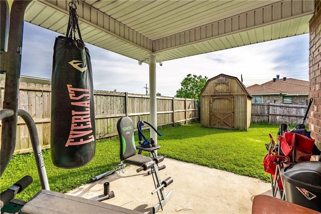 717 Magnolia Ave, La Place, LA 70068 - view of patio with a storage unit and an outbuilding
