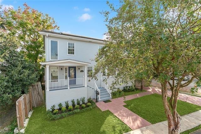 traditional style home with covered porch