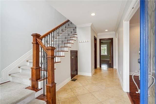 staircase with ornamental molding, recessed lighting, and tile patterned flooring