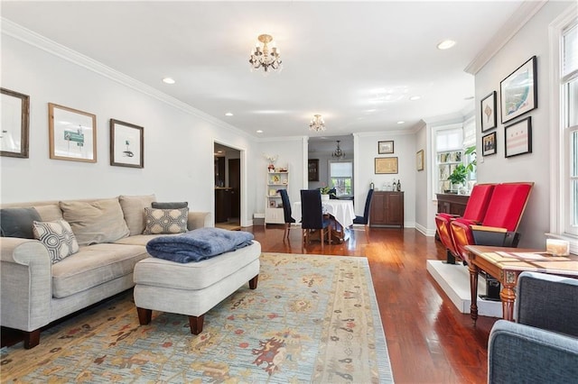 living room featuring a chandelier, recessed lighting, crown molding, wood finished floors, and baseboards