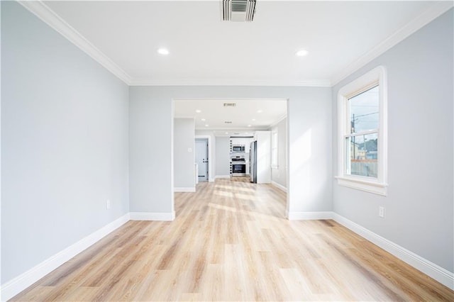 3827 Catherine Ave, Metairie, LA 70001 - unfurnished living room featuring light wood finished floors, baseboards, crown molding, and recessed lighting