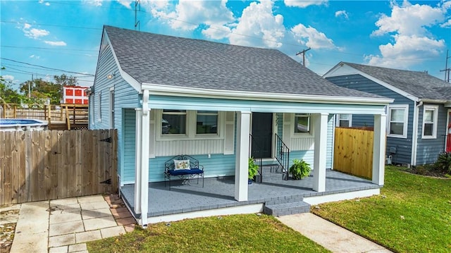 3827 Catherine Ave, Metairie, LA 70001 - back of house featuring roof with shingles and a porch