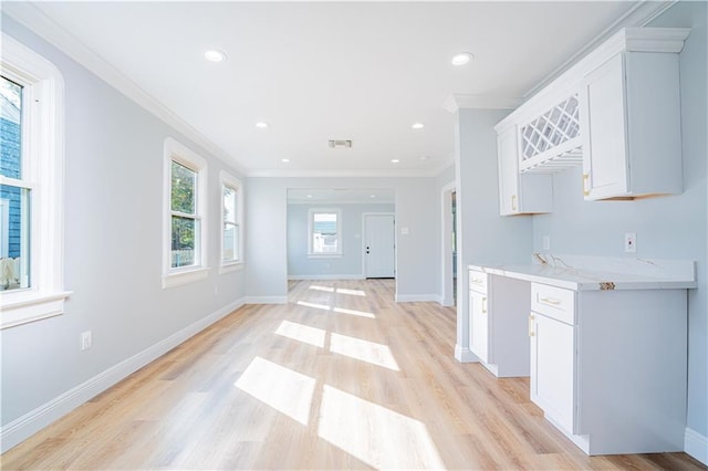 3827 Catherine Ave, Metairie, LA 70001 - kitchen featuring ornamental molding, white cabinetry, light wood-style floors, baseboards, and recessed lighting