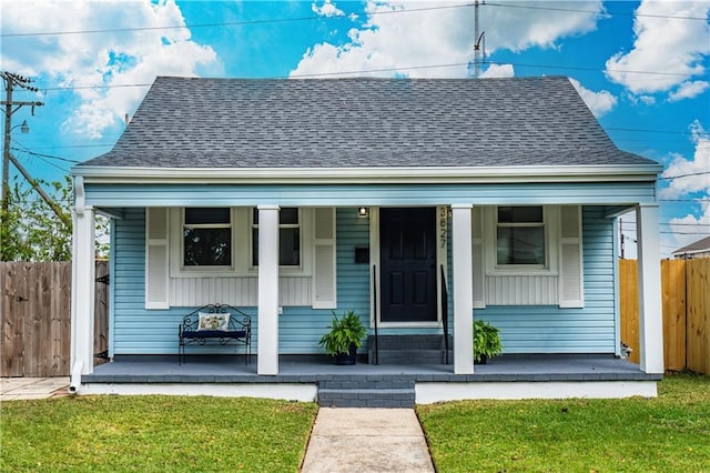 3827 Catherine Ave, Metairie, LA 70001 - bungalow-style house featuring a porch, fence, and roof with shingles
