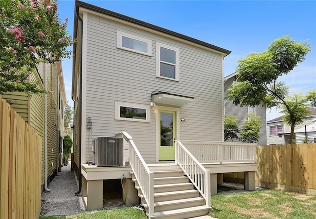 218 S Gayoso St, New Orleans, LA 70119 - rear view of property with fence, a wooden deck, central air condition unit, and stairway