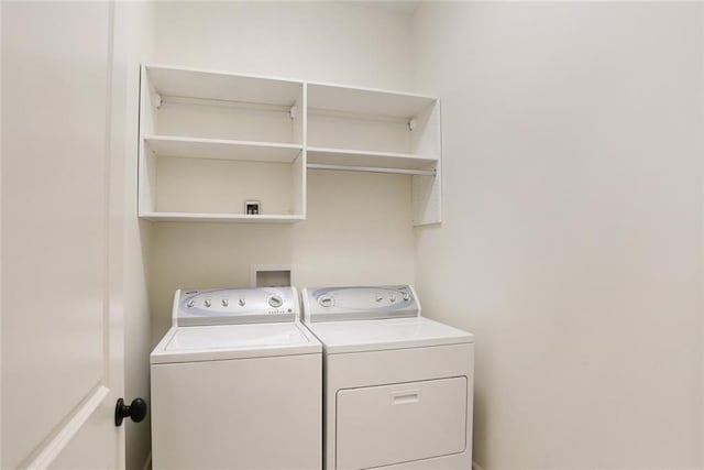 218 S Gayoso St, New Orleans, LA 70119 - clothes washing area with washing machine and dryer