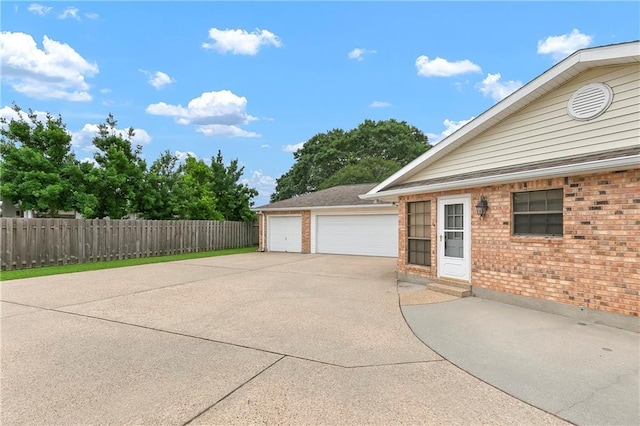 1 Fairfax Ct, Marrero, LA 70072 - view of side of home with brick siding, a detached garage, and entry steps