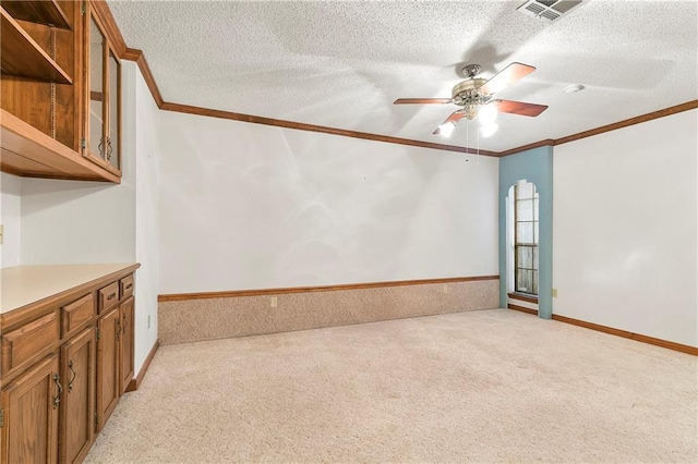 1 Fairfax Ct, Marrero, LA 70072 - spare room with light carpet, ornamental molding, a ceiling fan, and a textured ceiling