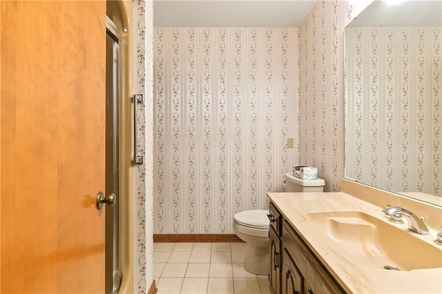 1 Fairfax Ct, Marrero, LA 70072 - bathroom featuring wallpapered walls, tile patterned flooring, toilet, vanity, and baseboards