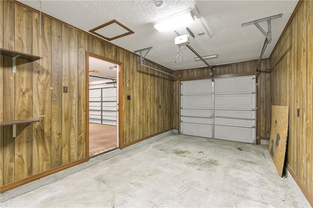 1 Fairfax Ct, Marrero, LA 70072 - garage featuring wood walls and a garage door opener