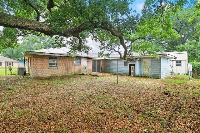 121 Saint Nicholas St, Luling, LA 70070 - rear view of property with central AC unit and brick siding