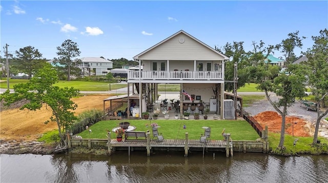 4102 Pennsylvania St, Bay Saint Louis, MS 39520 - back of house featuring stairway, a patio, a deck with water view, and a yard