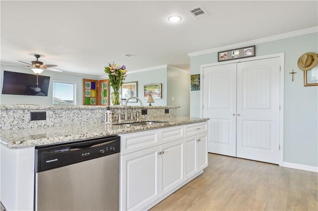 4102 Pennsylvania St, Bay Saint Louis, MS 39520 - kitchen featuring stainless steel dishwasher, a sink, crown molding, white cabinetry, and light wood-style flooring